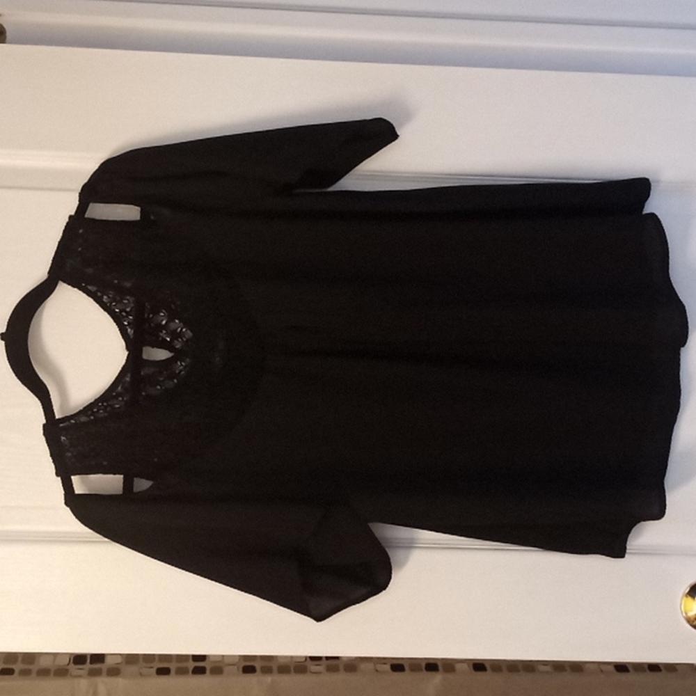 Black blouse with knitting and naked shoulders